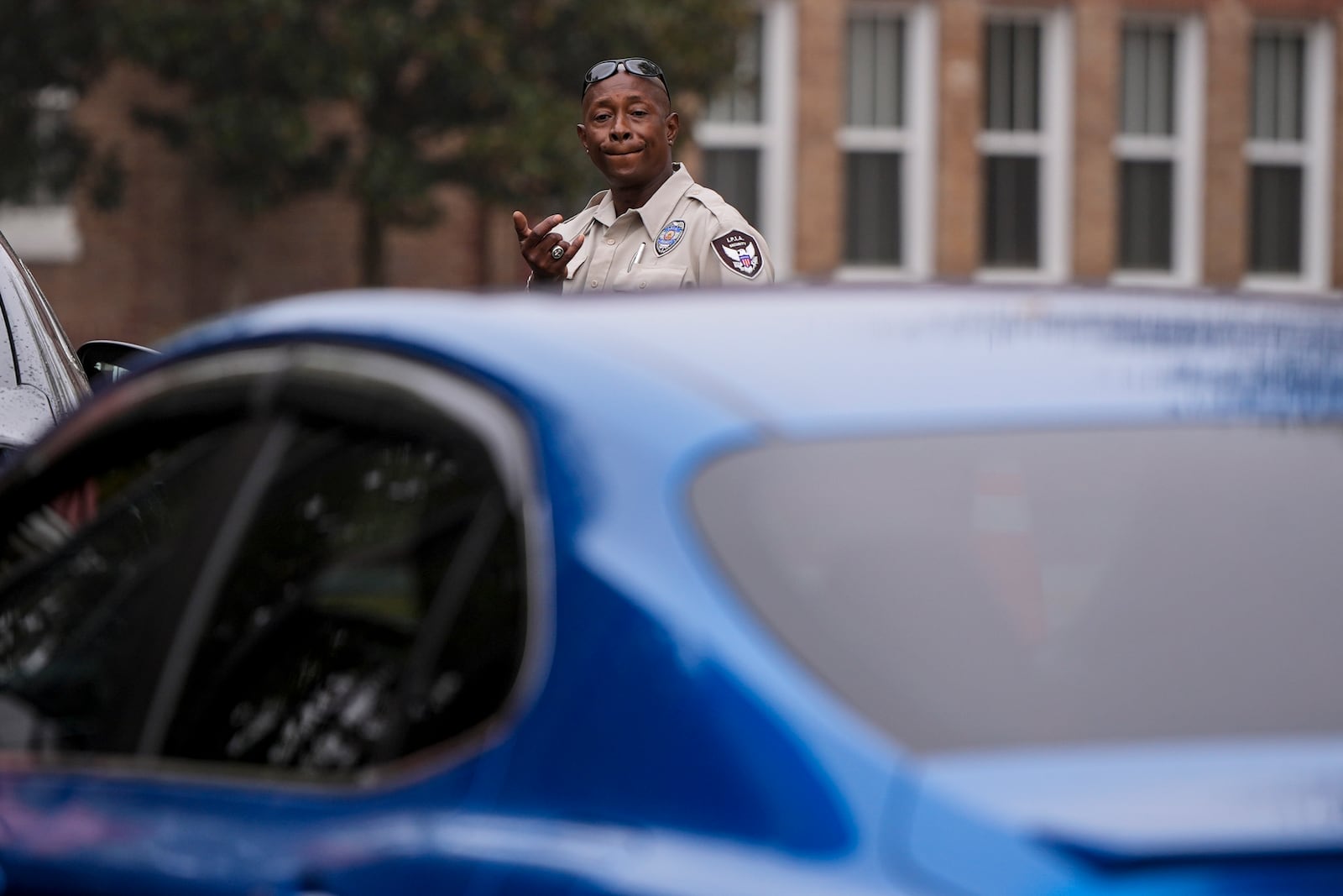 Police inspect vehicles for identification as they enter Tuskegee University, Monday, Nov. 11, 2024, in Tuskegee, Ala. (AP Photo/Mike Stewart)