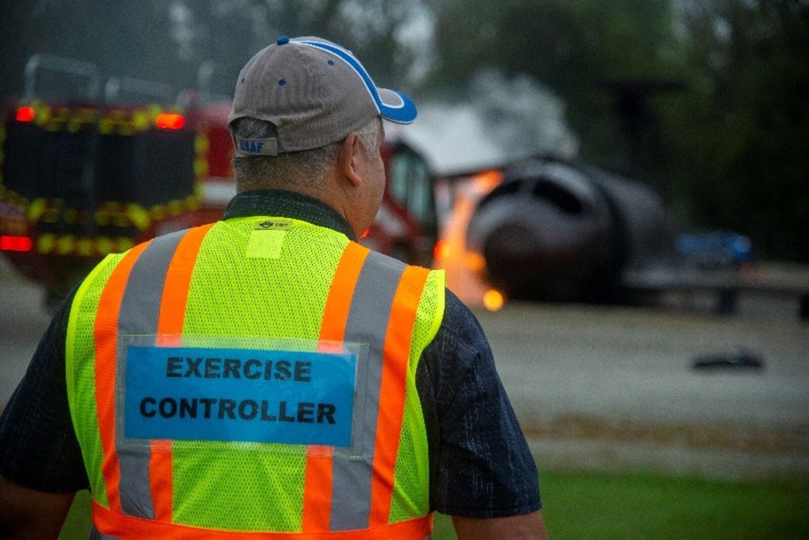 Miguel Diaz, exercise/inspection program manager for the 88th Air Base Wing, surveys the scene of a simulated C-17 aircraft crash as part of an exercise Oct. 7 at Wright-Patterson Air Force Base. (U.S. Air Force photo by Senior Airman Jack Gardner)