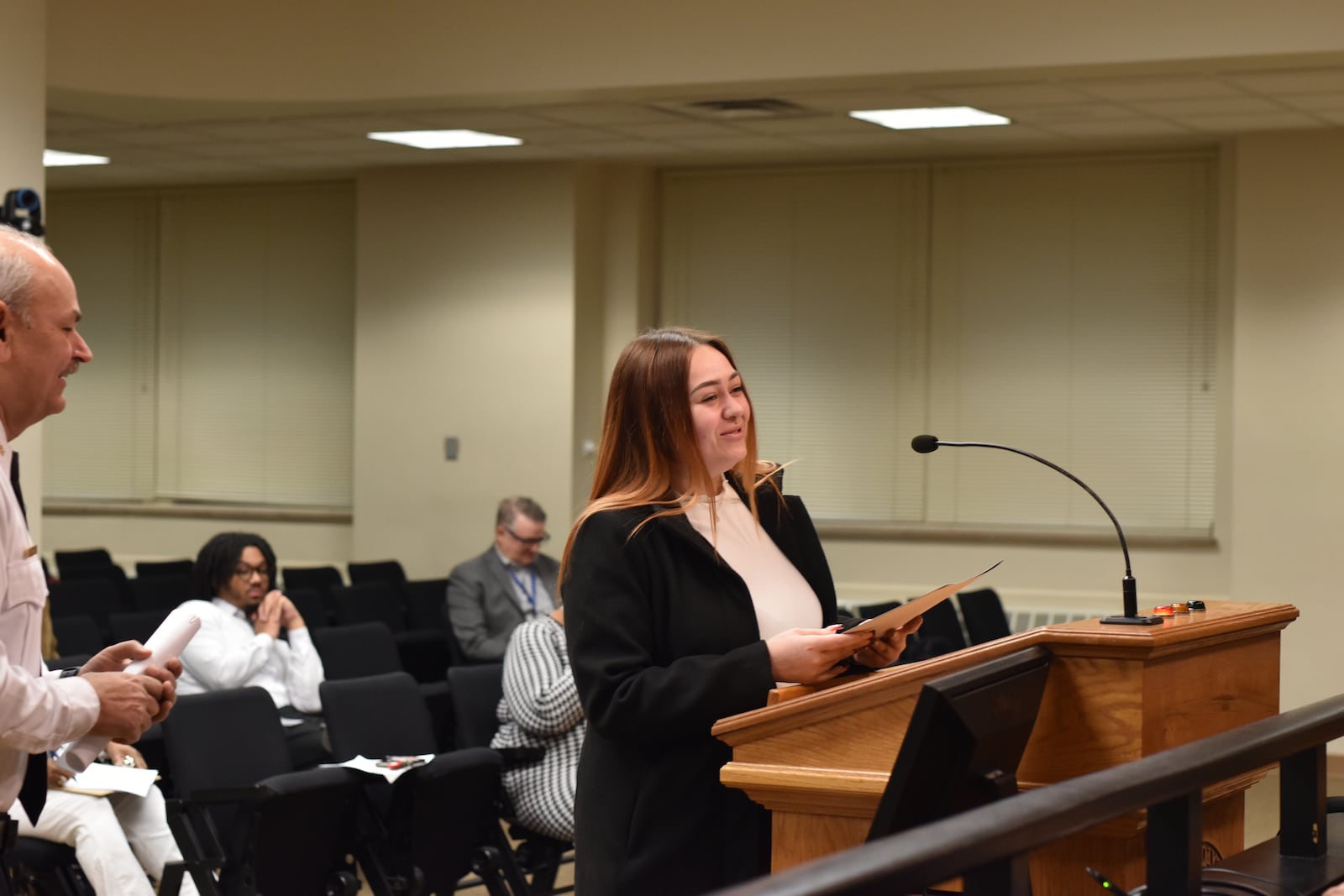 Savannah Shediack, 28, of Springfield, was honored on Wednesday at City Hall for helping save the life of a police recruit who was injured in a car crash in October. CORNELIUS FROLIK / STAFF