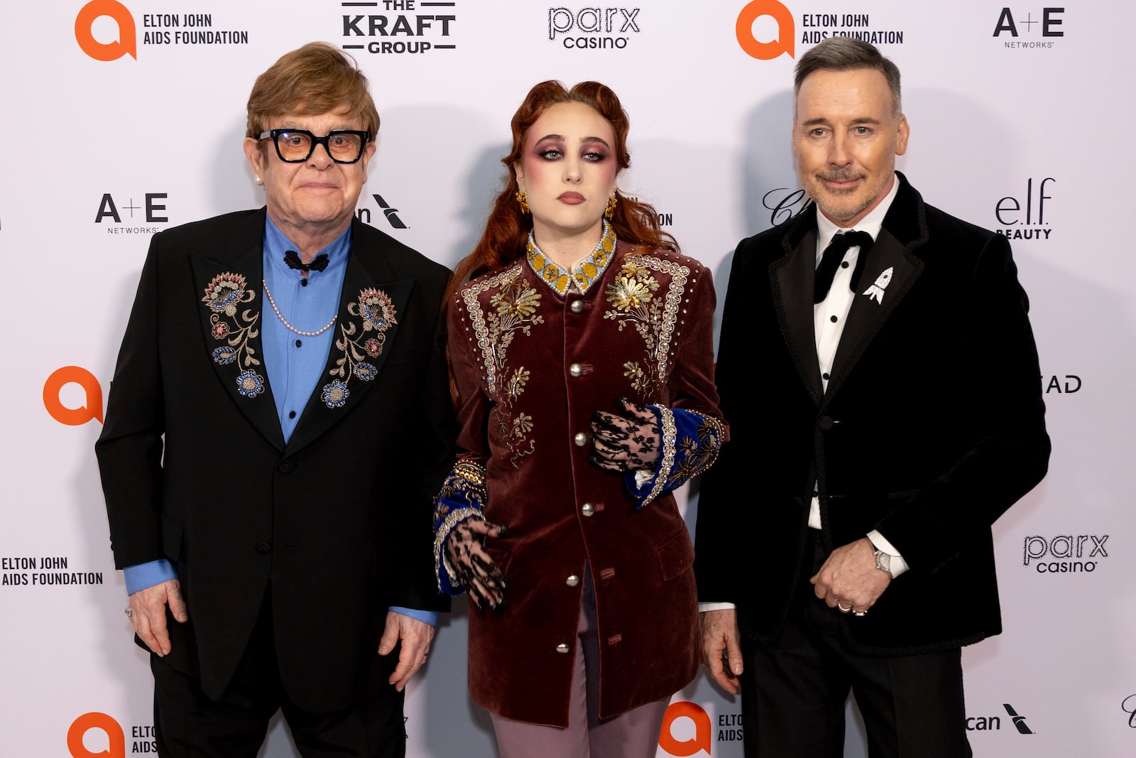 Elton John, from left, Chapell Roan and David Furnish arrive at the 33rd Annual Elton John AIDS Foundation Academy Awards Viewing Party on Sunday, March 2, 2025, in West Hollywood, Calif. (Photo by Willy Sanjuan/Invision/AP)