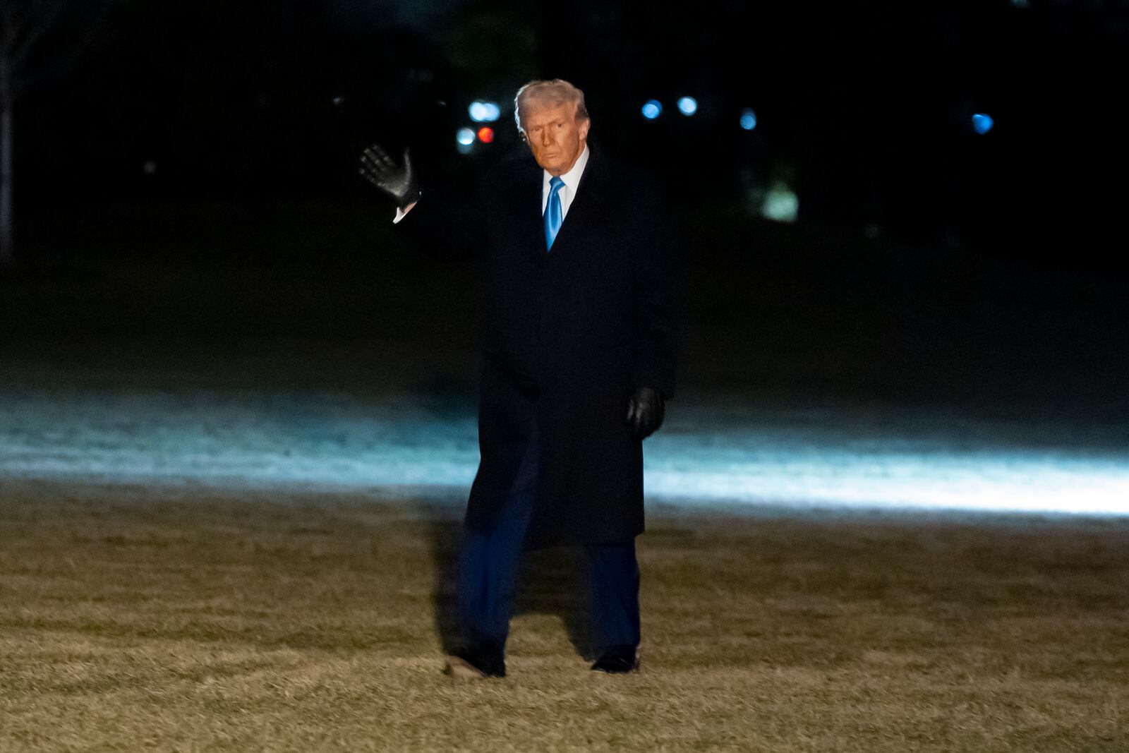 President Donald Trump waves as he walks from Marine One after arriving on the South Lawn of the White House, Wednesday, Feb. 19, 2025, in Washington. (AP Photo/Alex Brandon)