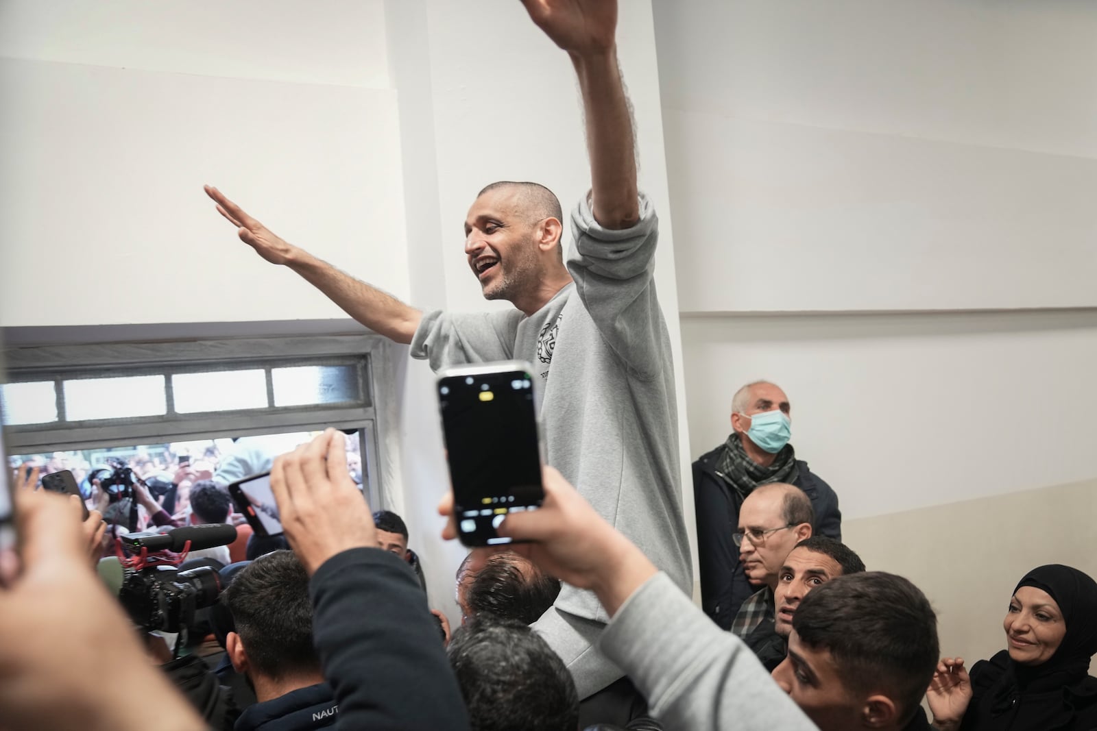 Mohammed Aradeh, 42, an Islamic Jihad militant, is greeted after his release from an Israeli prison following a cease fire agreement between Hamas and Israel, in the West Bank city of Ramallah, Saturday, Jan. 25, 2025. Aradeh became something of a Palestinian folk hero in 2021 along with five other prisoners after an extraordinary escape from Israel's most secure prison. (AP Photo/Mahmoud Illean)