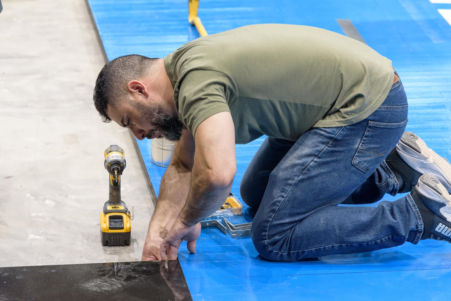 PHOTOS: NCAA First Four basketball court installation at UD Arena