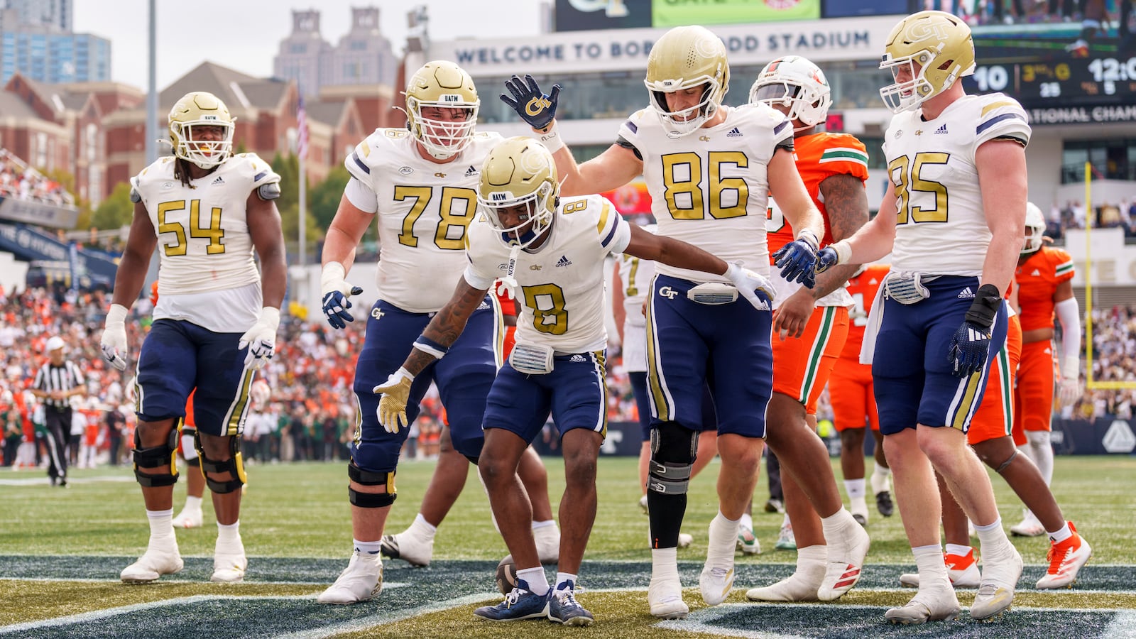 Georgia Tech wide receiver Malik Rutherford (8) celebrates in the end zone after scoring during the first half of an NCAA college football game against Miami, Saturday, Nov. 9, 2024, in Atlanta. (AP Photo/Jason Allen)