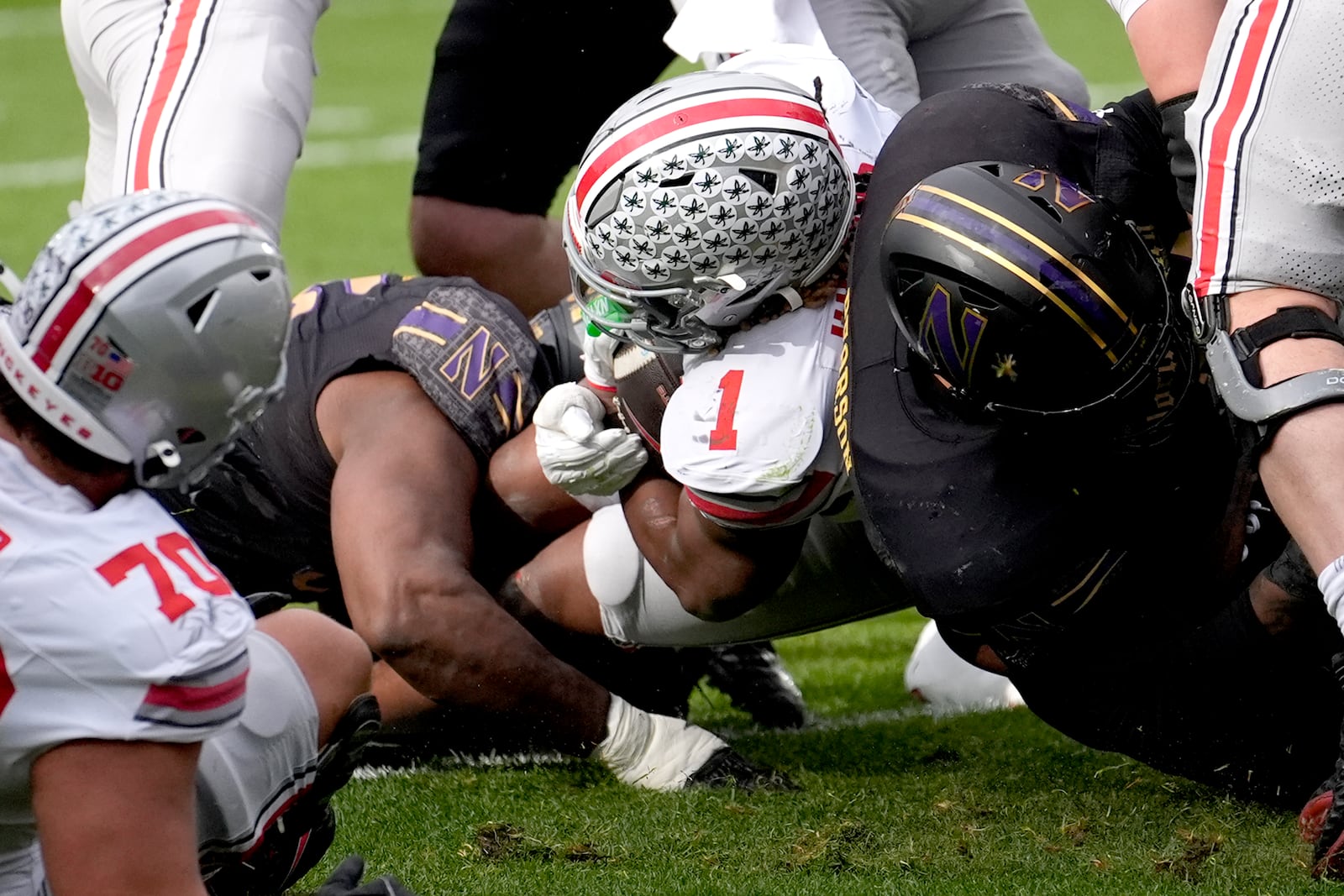 Ohio State running back Quinshon Judkins (1) scores during the first half of an NCAA college football game against Northwestern at Wrigley Field on Saturday, Nov. 16, 2024, in Chicago. (AP Photo/Charles Rex Arbogast)