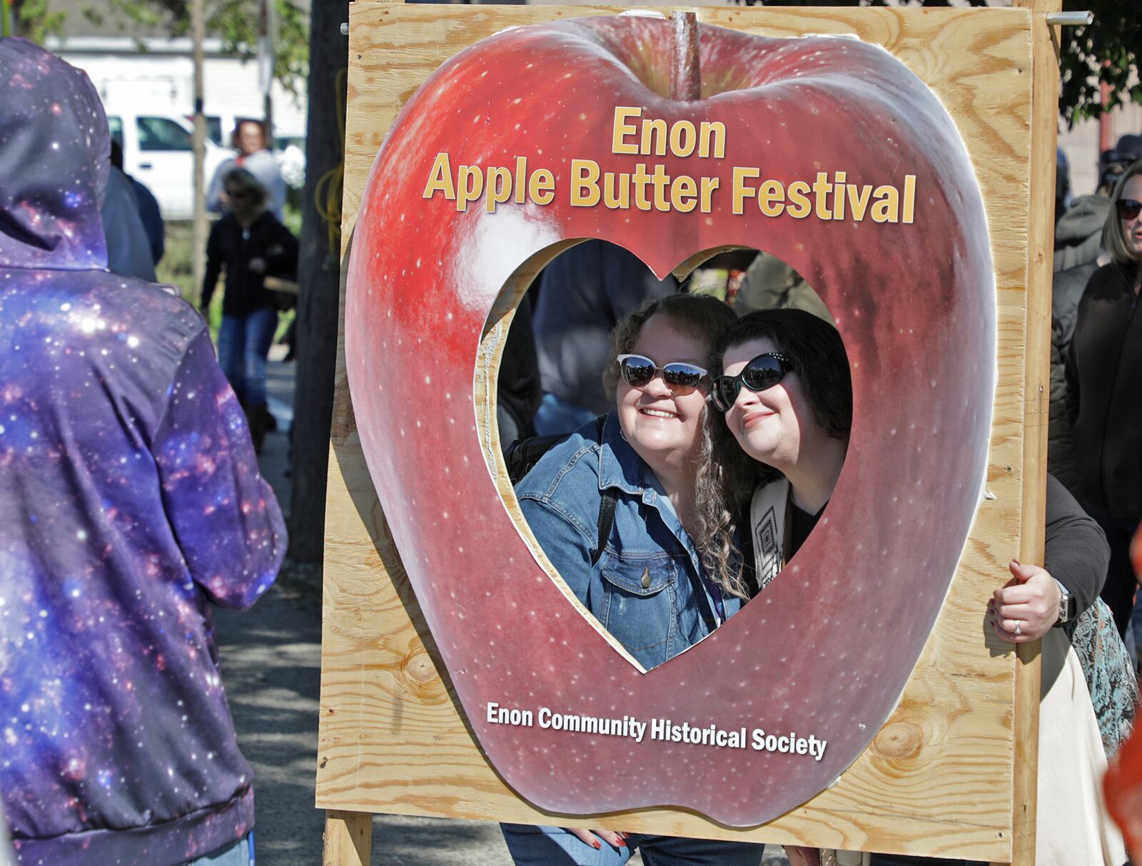 Original cutline: Honey Greene, left, and Wendy Adams pose for a picture in a cut out at the Enon Apple Butter Festival Saturday. BILL LACKEY/STAFF