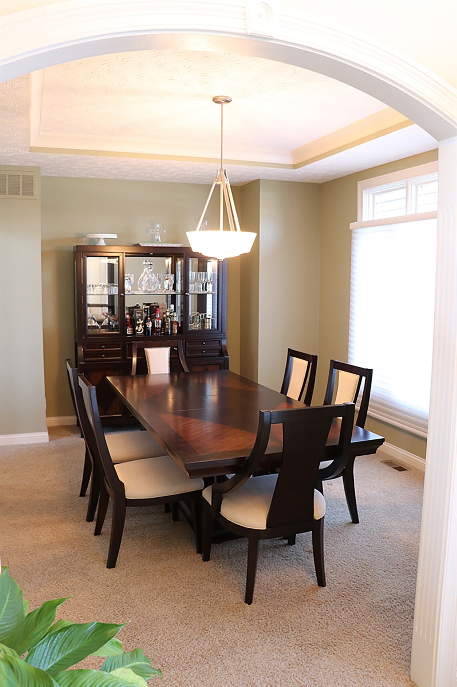 Off the foyer, the formal dining room has a tray ceiling and furniture nook as well as direct access to the kitchen. CONTRIBUTED PHOTO BY KATHY TYLER