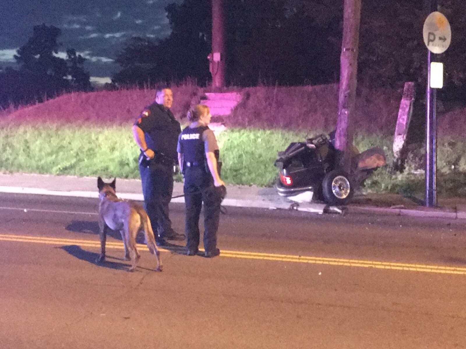 Dayton police use a K9 to track a suspect seen fleeing from the scene of an auto accident where the vehicle split in half on impact.