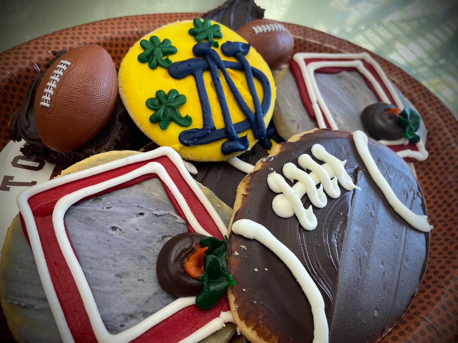 Theresa Hammons, who owns Ashley’s Pastry Shop with her husband, Greg, is preparing for the College Football Playoff championship game with treats honoring both teams. NATALIE JONES/STAFF