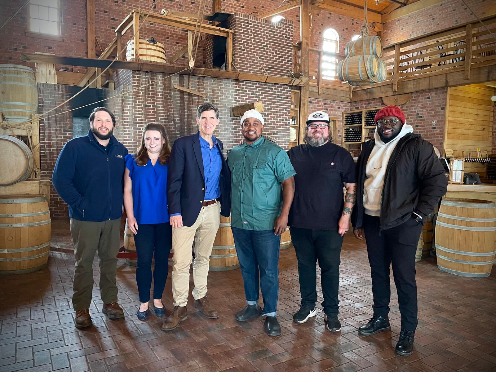 Carillon Brewing Co. is teaming up with Dayton Barbecue Company for the rebirth of its food program. Pictured (left to right) is Head Brewer Kyle Spears, Director of Restaurants & Retail Emily Teters, President & CEO Brady Kress, Owner Eric Evans, Executive Chef Ashley Ashbrook and Owner Ezekiel Cowell. NATALIE JONES/STAFF