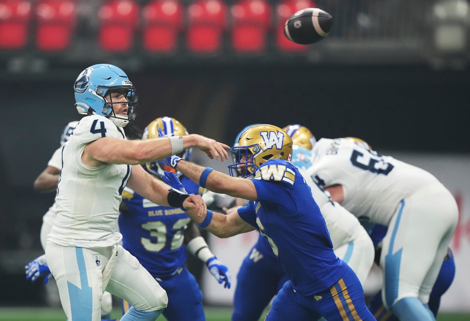 Toronto Argonauts quarterback Nick Arbuckle (4) passes against the Winnipeg Blue Bombers during the second half of a CFL football game at the 111th Grey Cup in Vancouver, British Columbia, Sunday, Nov. 17, 2024. (Nathan Denette/The Canadian Press via AP)