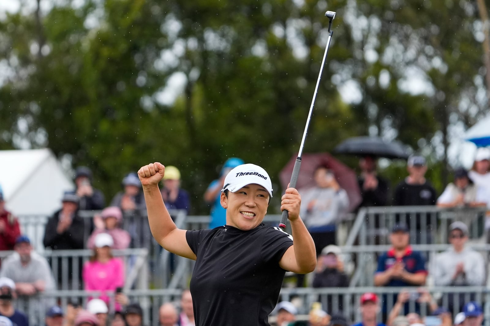 Jiyai Shin of Korea reacts on the 18th green after winning the Australian Open women's golf championship at the Kingston Heath Golf Club in Melbourne, Australia, Sunday, Dec. 1, 2024. (AP Photo/Asanka Brendon Ratnayake)