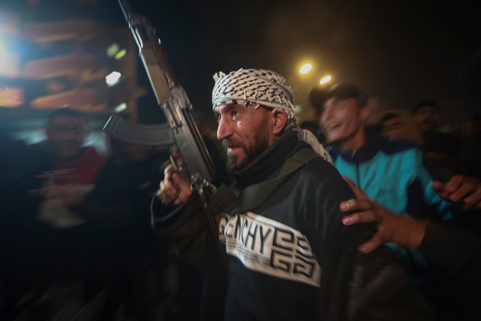 Palestinians celebrate the imminent announcement of a ceasefire deal between Hamas and Israel in Khan Younis, central Gaza Strip, Wednesday, Jan. 15, 2025.(AP Photo/(AP Photo/Jehad Alshrafi)