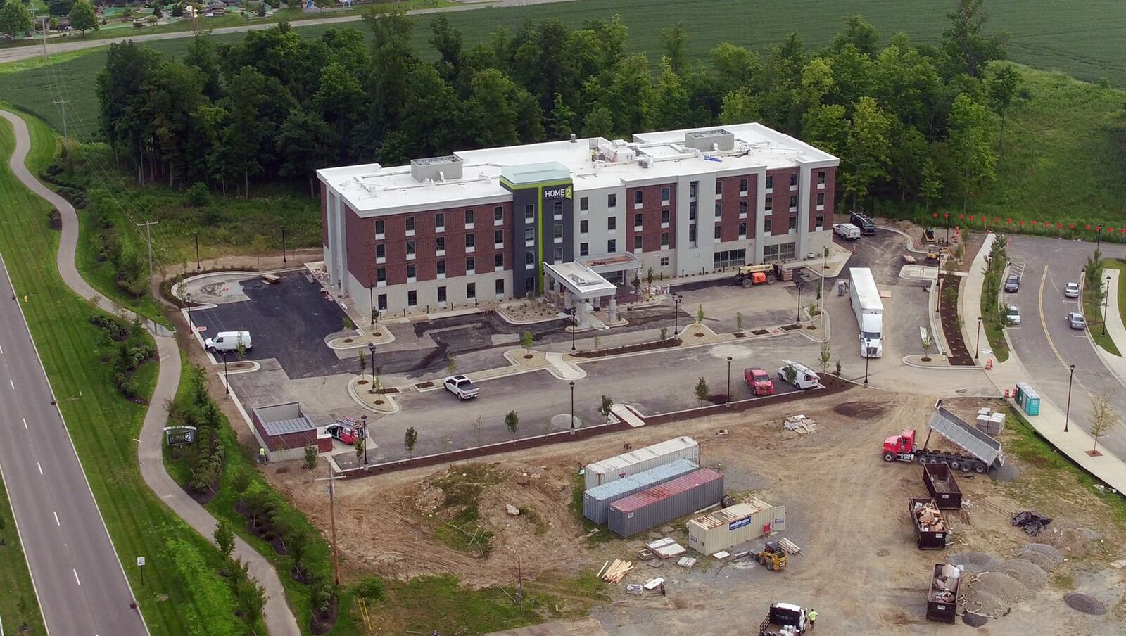 The exterior of the new Home2 Suites by Hilton at Cornerstone appears to be complete and is one of many new construction projects underway along the Wilmington Pike corridor. TY GREENLEES / STAFF