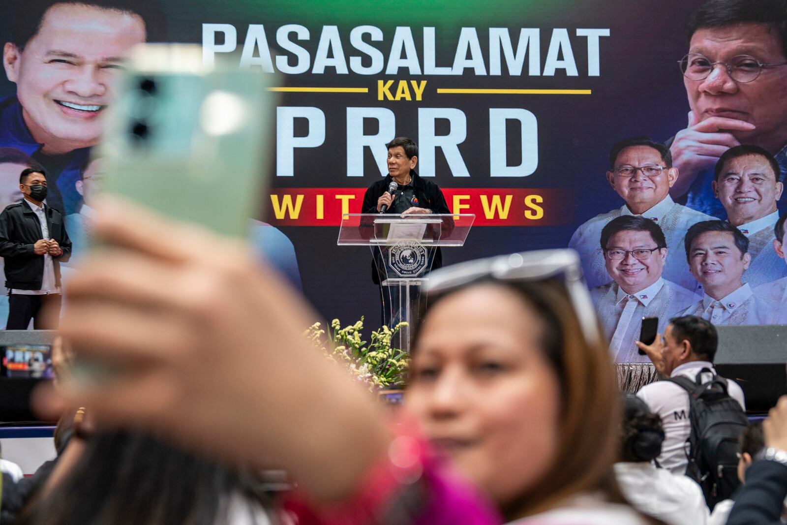 Former President of the Philippines Rodrigo Duterte speaks inside the Southorn Stadium during a thanksgiving gathering organized by Hong Kong-based Filipino workers for the former populist president in Hong Kong on Sunday, March 9, 2025. (AP Photo/Vernon Yuen)