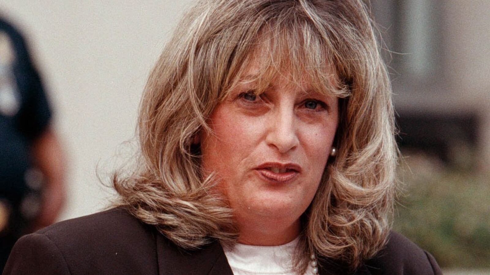 1998 FILE PHOTO: Linda Tripp talks to the press outside the Federal Courthouse July 29, 1998 in Washington, DC. After finishing her testimony before Kenneth Starr's grand jury, Linda Tripp, whose tape recordings of Monica Lewinsky led to an investigation of an alleged presidential affair, spoke at length publicly for the first time, saying she was an average American. (Georges De Keerle/Getty Images)