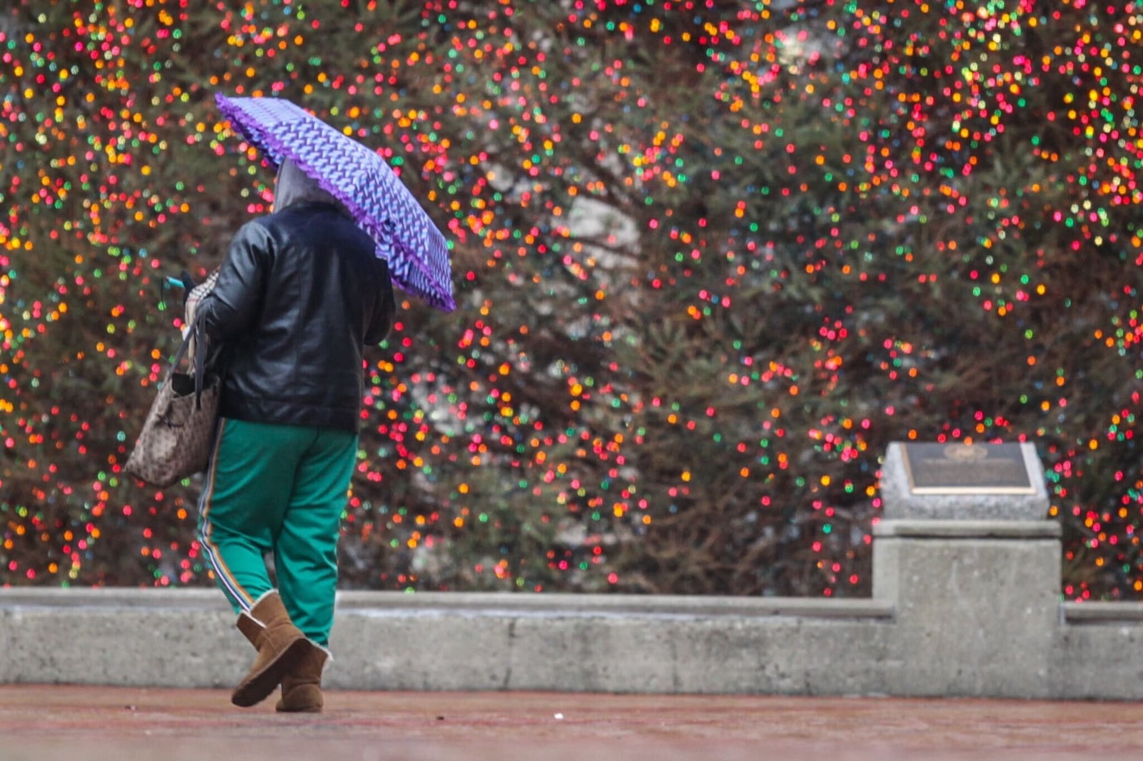 The Courthouse Square Christmas tree in Dayton glows brightly on a rainy and cold Monday Dec. 21, 2020. It is also the winter solstice, the longest night of the year and the official start of winter. Jim Noelker/Staff