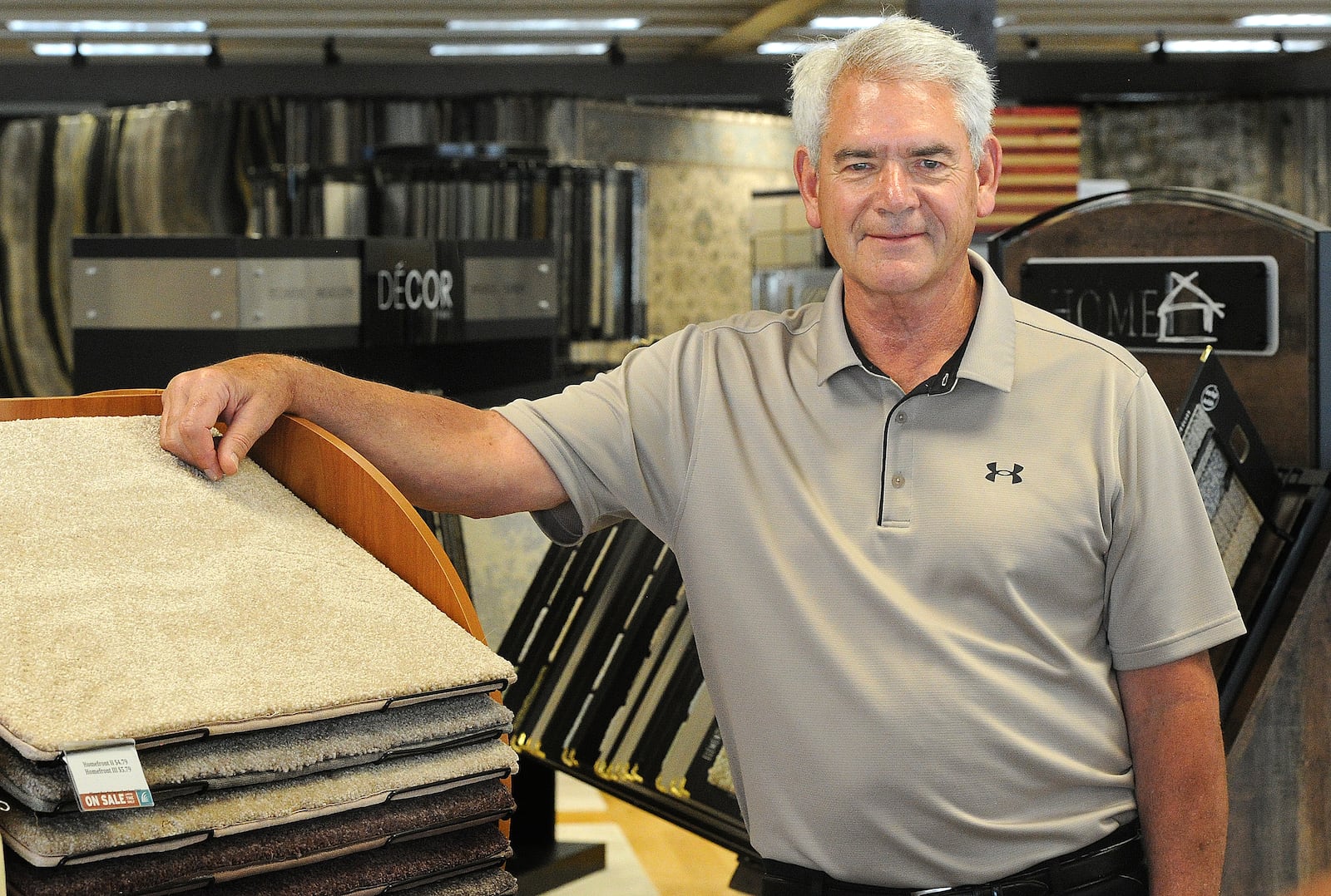 Tom Kenney is celebrating his 50th year working at Bockrath Flooring & Rugs, located at 5557 Far Hills Ave. in Washington Twp. MARSHALL GORBY/STAFF