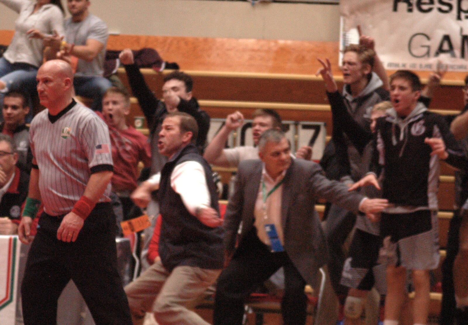 Graham coach Jeff Jordan (vest) celebrates Graham’s D-I state title. The D-II Falcons defeated perennial D-I power St. Ed’s 28-23 in the finals. John Cummings/CONTRIBUTED