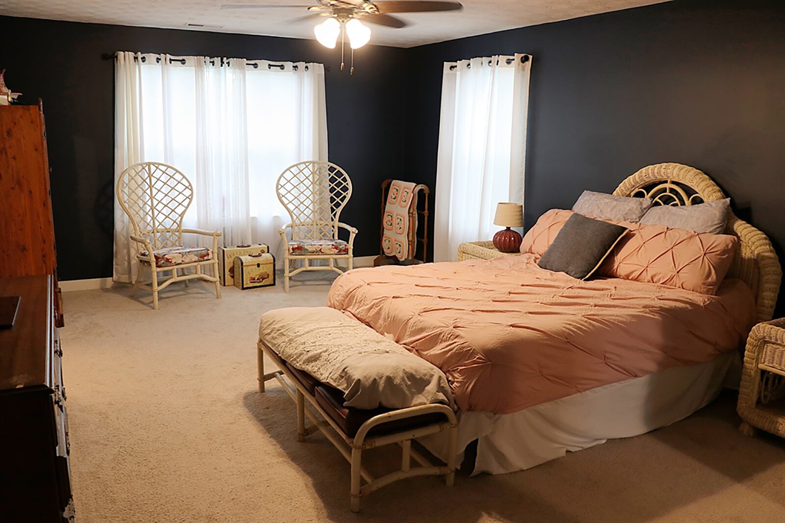 On the second floor, the main bedroom suite has a sitting area and a walk-in closet with a window. CONTRIBUTED PHOTO BY KATHY TYLER