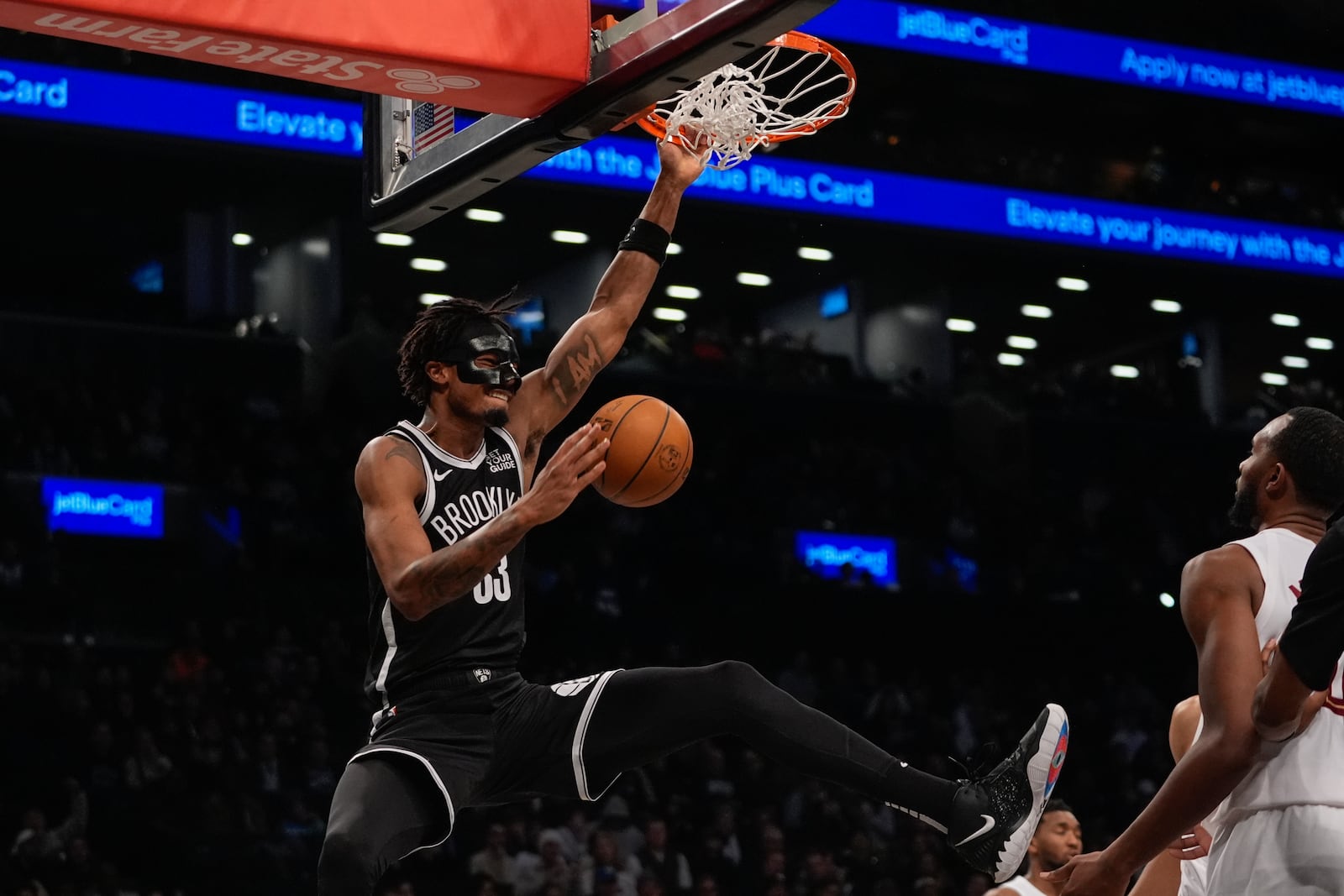 Brooklyn Nets' Nic Claxton (33) dunks the ball during the second half of an NBA basketball game against the Cleveland Cavaliers Thursday, Feb. 20, 2025, in New York. (AP Photo/Frank Franklin II)