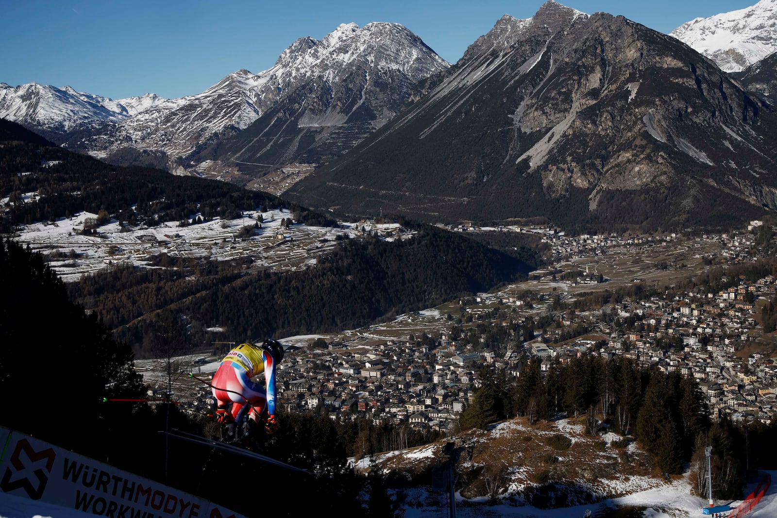 France's Cyprien Sarrazin is airborn during an alpine ski, men's World Cup downhill training, in Bormio, Italy, Friday, Dec. 27, 2024. (AP Photo/Gabriele Facciotti)