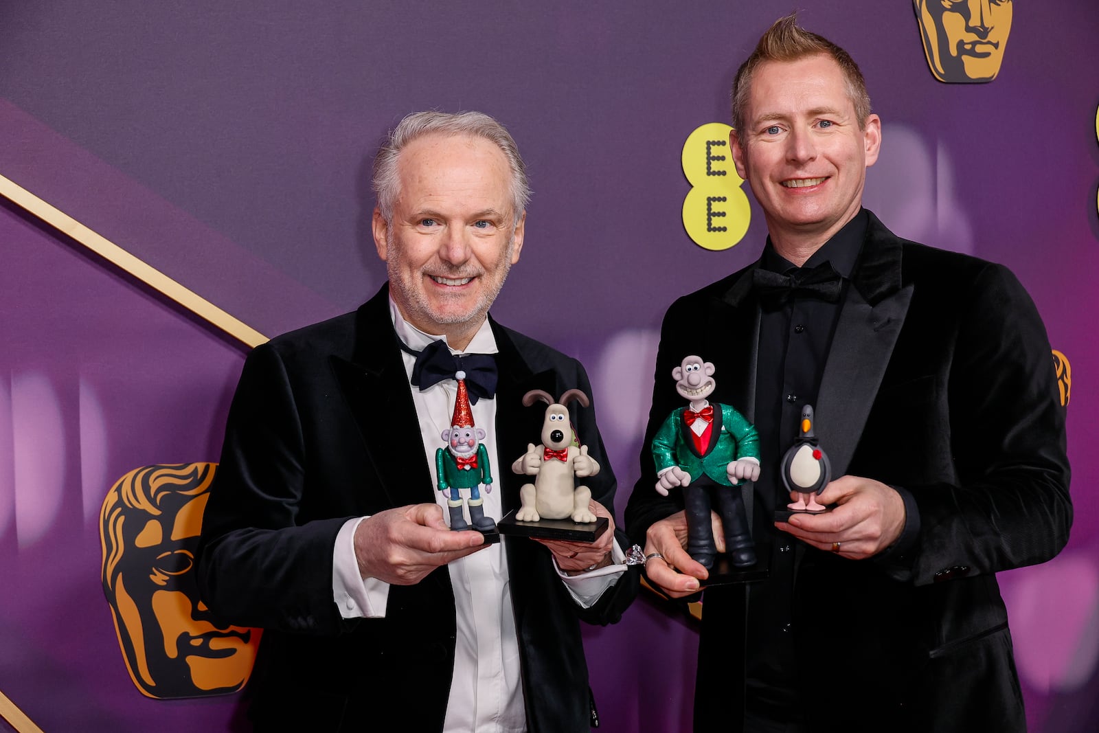 Nick Park, left, and Merlin Crossingham pose for photographers upon arrival at the 78th British Academy Film Awards, BAFTA's, in London, Sunday, Feb. 16, 2025. (Photo by Joel C Ryan/Invision/AP)