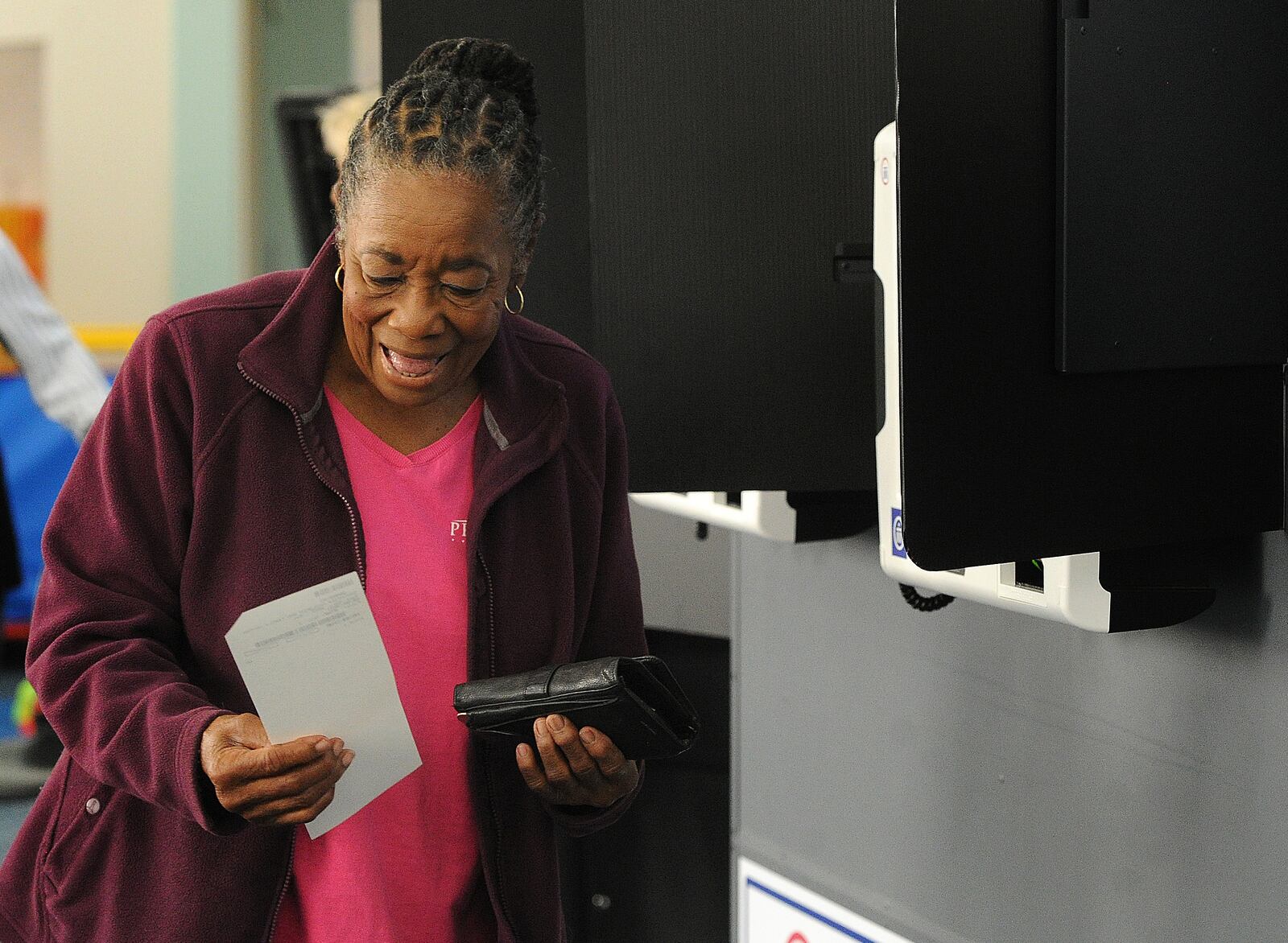 Gloria Payne, 79, casts her ballot on Tuesday Aug. 8 2023 at a Dayton-area polling location. She said she votes in every election because she remembers hearing from her mother about a time where every citizen couldn't vote. MARSHALL GORBY\STAFF