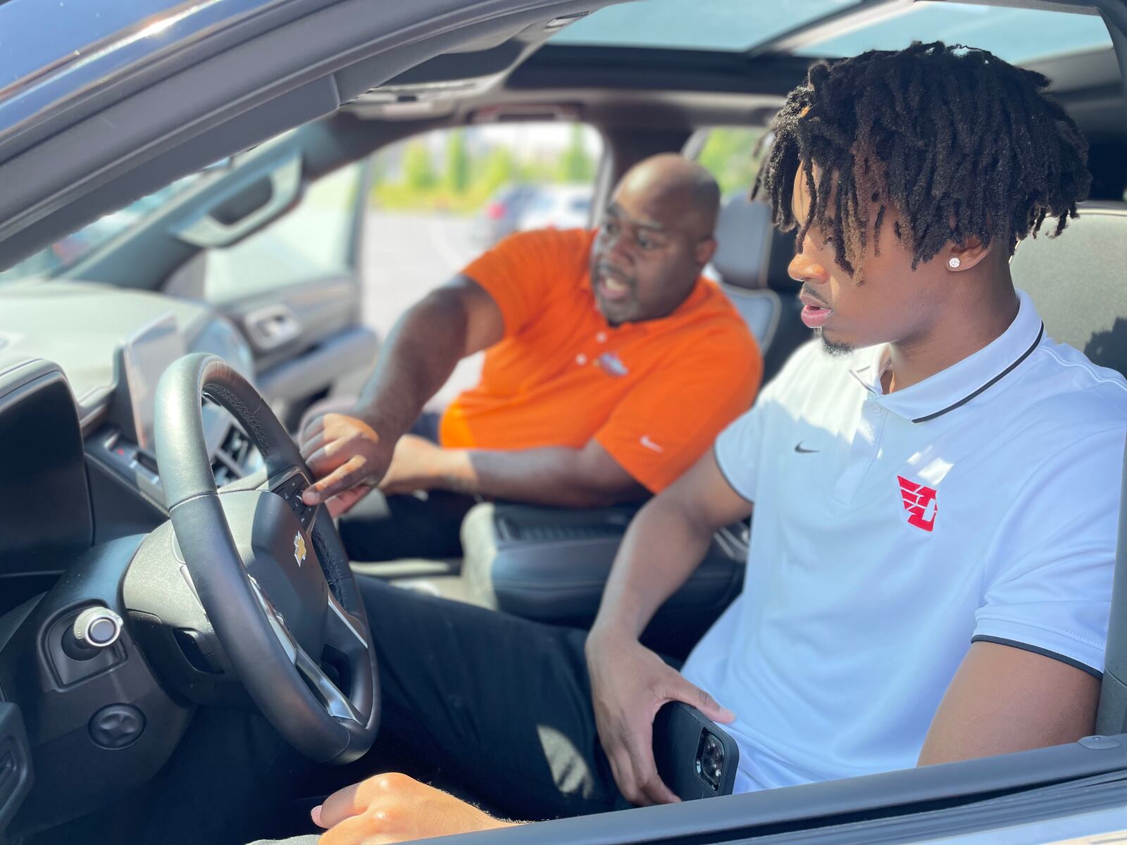 DaRon Holmes II poses for a photo with Tim White Jr., President of of White-Allen, on Friday, July 15, 2022, after receiving the keys to a Chevy Tahoe. Photo courtesy of Matt Farrell