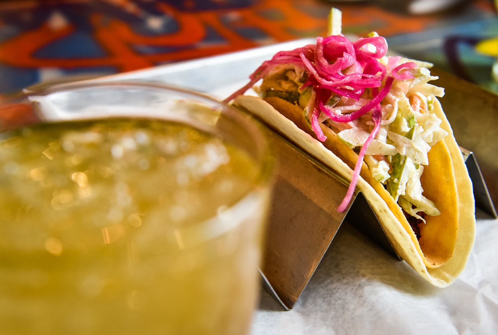 Agave & Rye has opened a location at Liberty Center in Liberty Township. The restaurant features a variety of tacos and large selection of tequilas and bourbons. This is their first location in Ohio. They have locations in Covington and Lexington in Kentucky. This is The Epic Taco with slab pork belly, apple slaw, pickled onion and rattlesnake sauce served here with Bourbon Peach Punch. NICK GRAHAM/STAFF