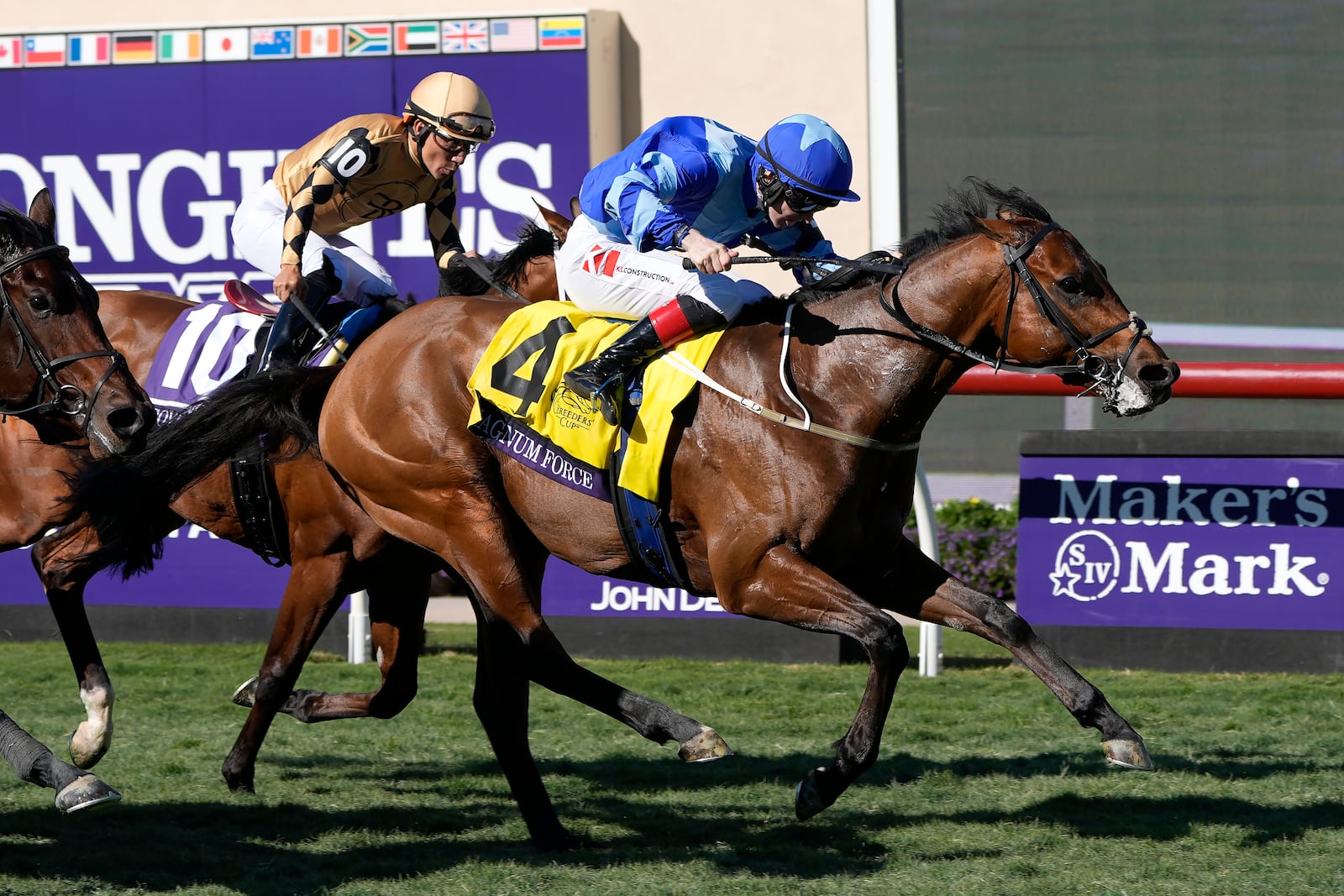 Colin Keane rides Magnum Force (4) in front of Paco Lopez riding Governor Sam (10) in the Breeders' Cup Juvenile Turf Sprint horse race at Santa Anita Park in Del Mar, Calif., Friday, Nov. 1, 2024. (AP Photo/Gregory Bull)