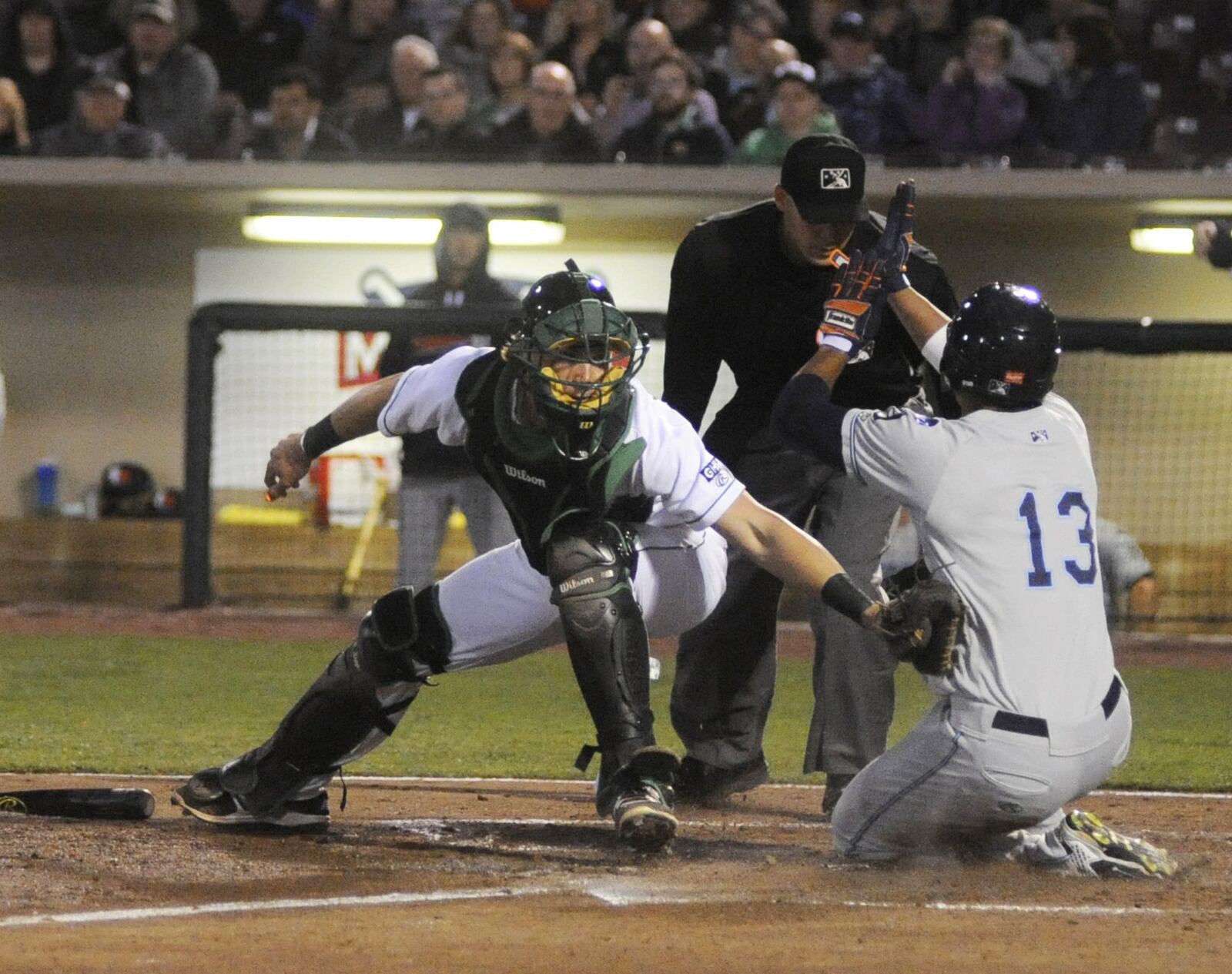 Dragons catcher Tyler Stephenson is too late with the tag on Elvis Rubio. The Dragons defeated the visiting West Michigan Whitecaps (Tigers) 3-2 in a Class A minor-league baseball game at Dayton’s Fifth Third Field on Tuesday, April 11, 2017. MARC PENDLETON / STAFF