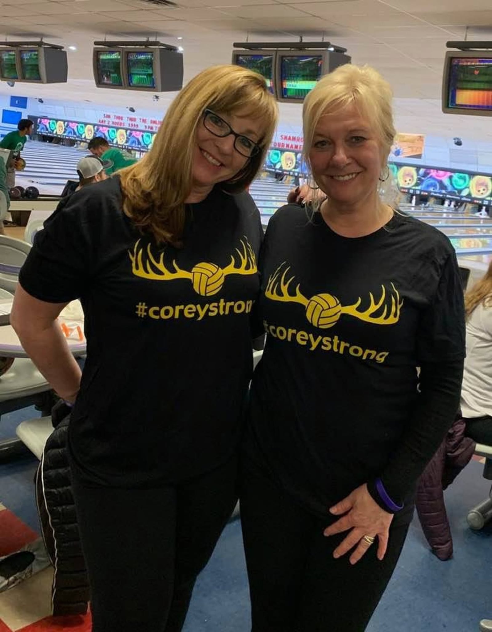 Corey Burge’s mom, Aimee Stephens (left) , and his fiancee’s mom, Marie Biggs, wearing #CoreyStrong T-shirts as their new bowling league uniforms. CONTRIBUTED