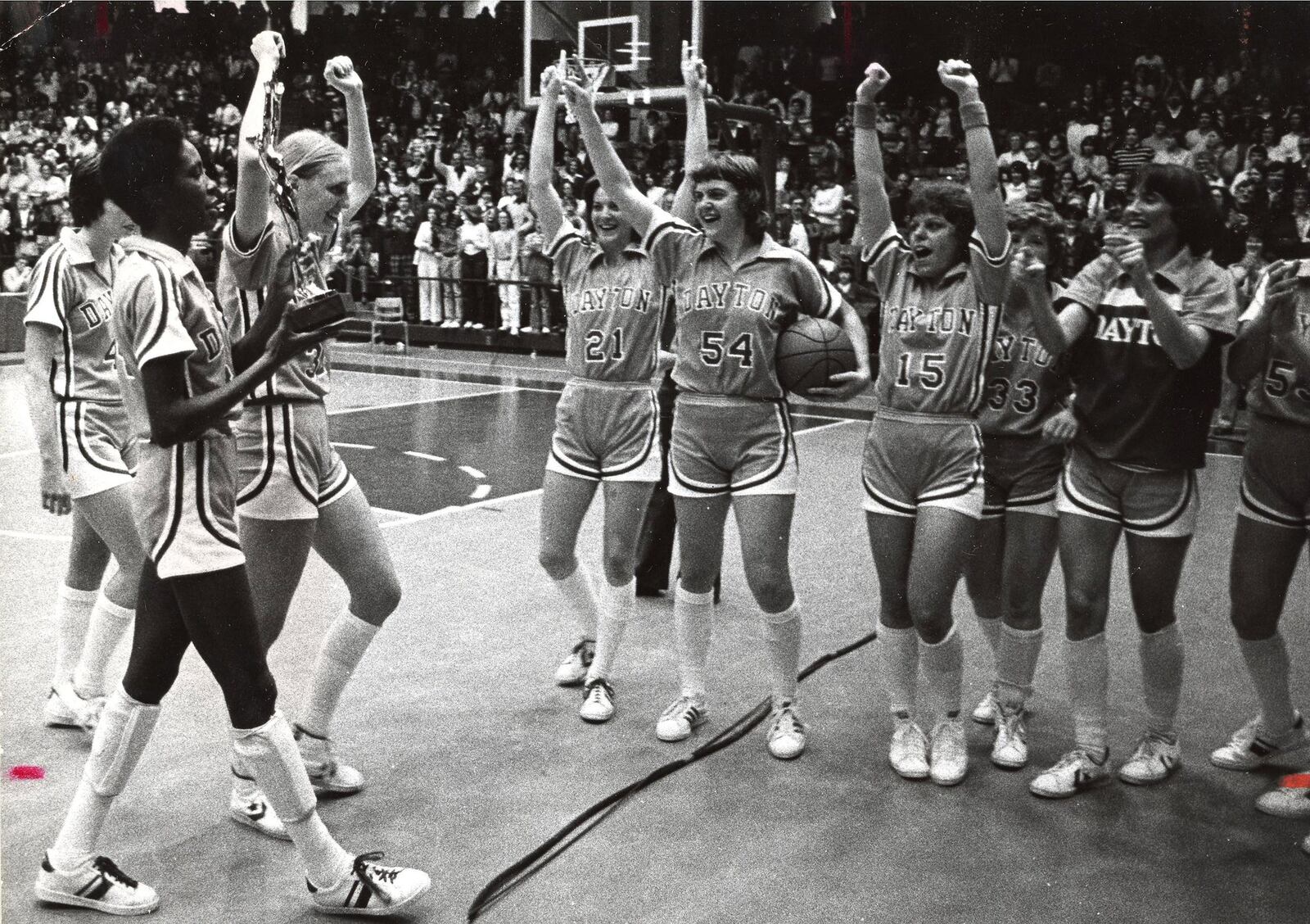 The University of Dayton Flyer womenâs basketball team celebrate their 1980 AIAW Division II National Championship win. The team beat the College of Charleston 85-53. DAYTON DAILY NEWS ARCHIVE