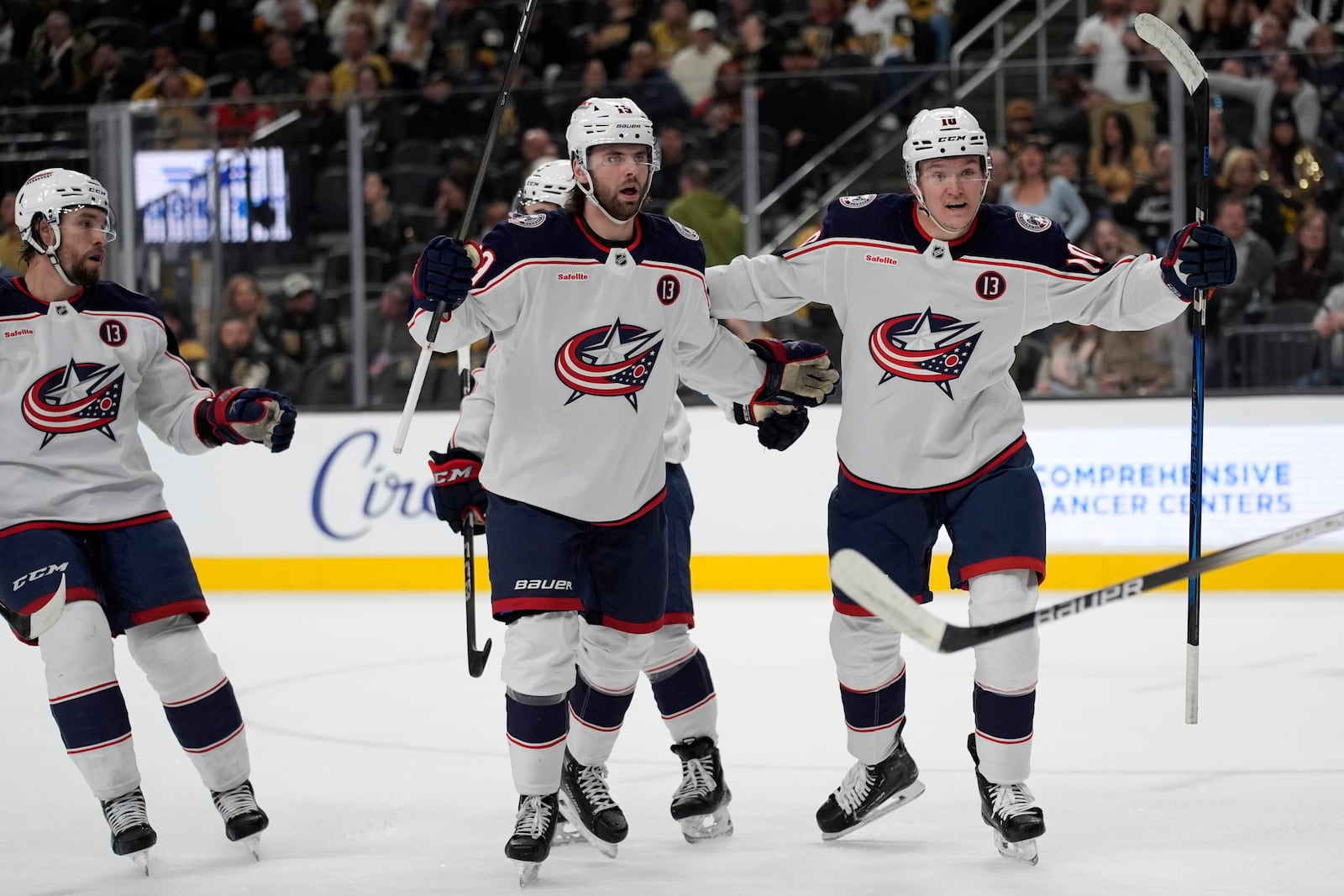 Columbus Blue Jackets center Adam Fantilli, center, celebrates after scoring against the Vegas Golden Knights during the first period of an NHL hockey game Thursday, Jan. 30, 2025, in Las Vegas. (AP Photo/John Locher)