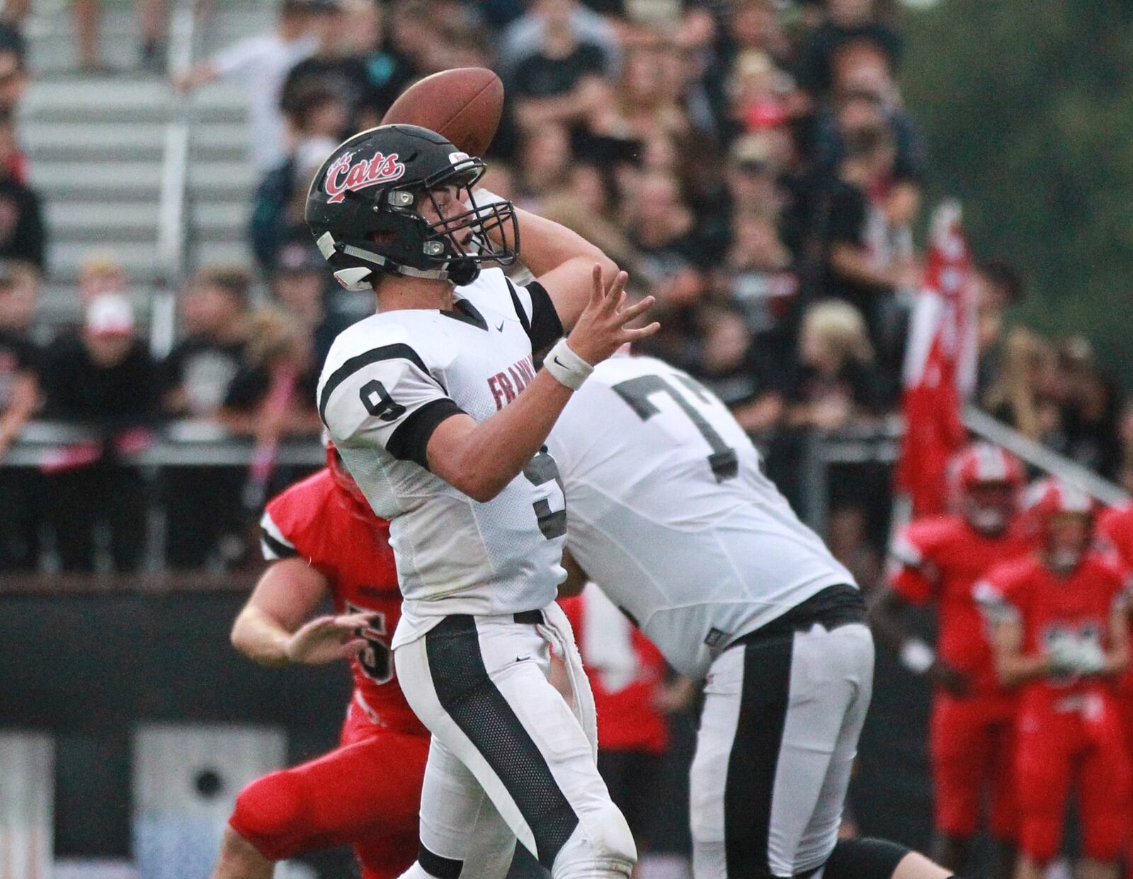 Franklin QB Braden Woods unloads a pass. Franklin defeated host Madison 42-6 in a Week 1 high school football opener on Friday, Aug. 30, 2019. MARC PENDLETON / STAFF