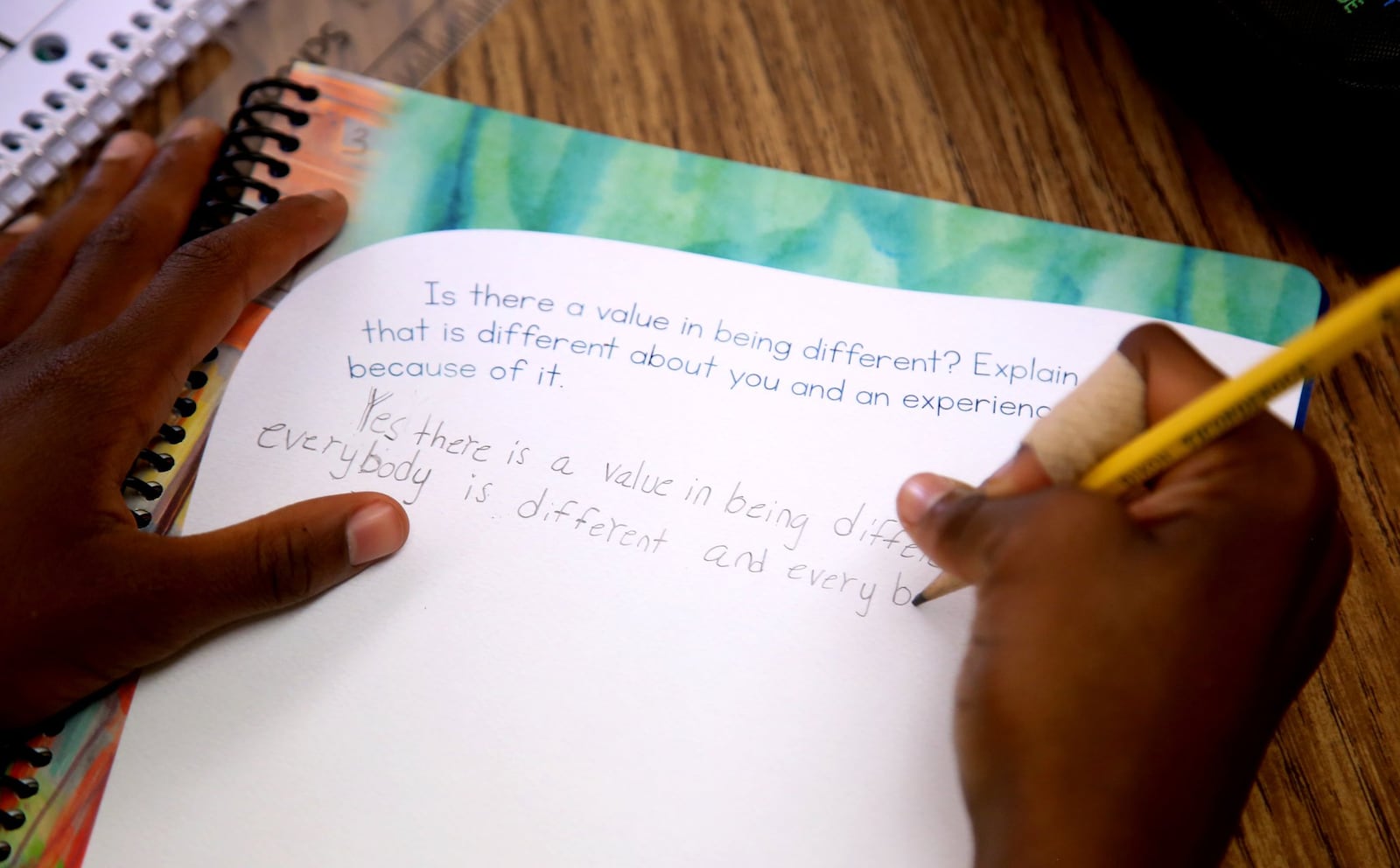 Fourth grade students at Northmoor Elementary School in Englewood regularly take time to write in journals during class. The practice is an effort to address social-emotional skills. LISA POWELL / STAFF