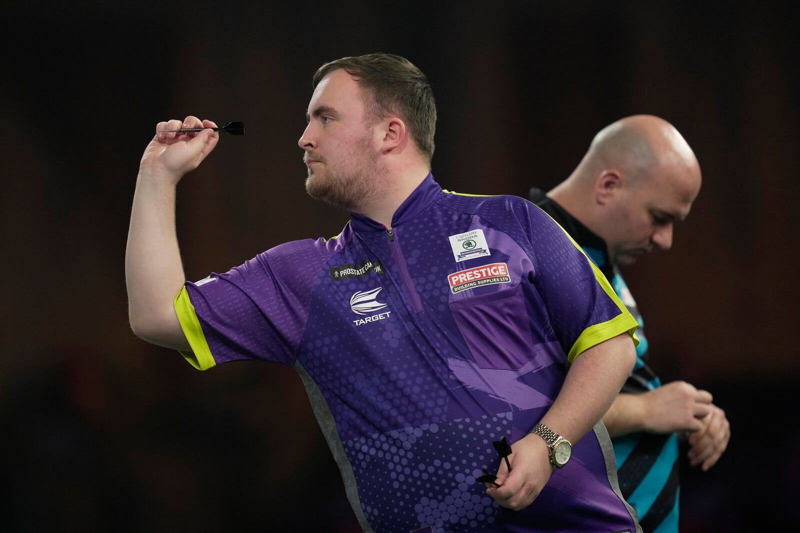 FILE - Luke Littler of England in action during the semifinal match against Scott Williams of England at the World Darts Championship, in London, Tuesday, Jan. 2, 2024. (AP Photo/Kin Cheung, File)