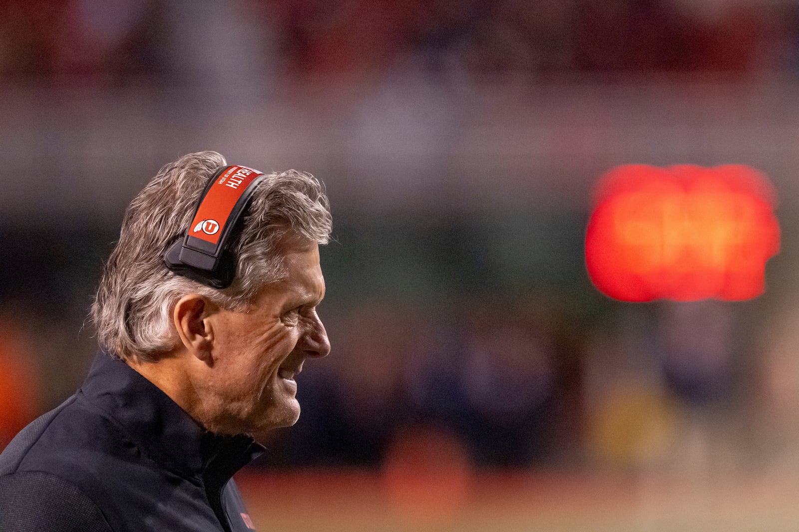 Utah head coach Kyle Whittingham walks onto the field during a time out in the first half of an NCAA college football game against BYU, Saturday, Nov. 9, 2024, in Salt Lake City. (AP Photo/Spenser Heaps)