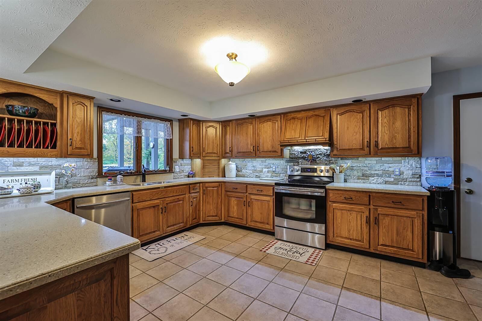 Tucked off the great room is the eat-in kitchen. A peninsula counter with stone accents creates a breakfast setting as well as divides the kitchen from the breakfast room. CONTRIBUTED PHOTO