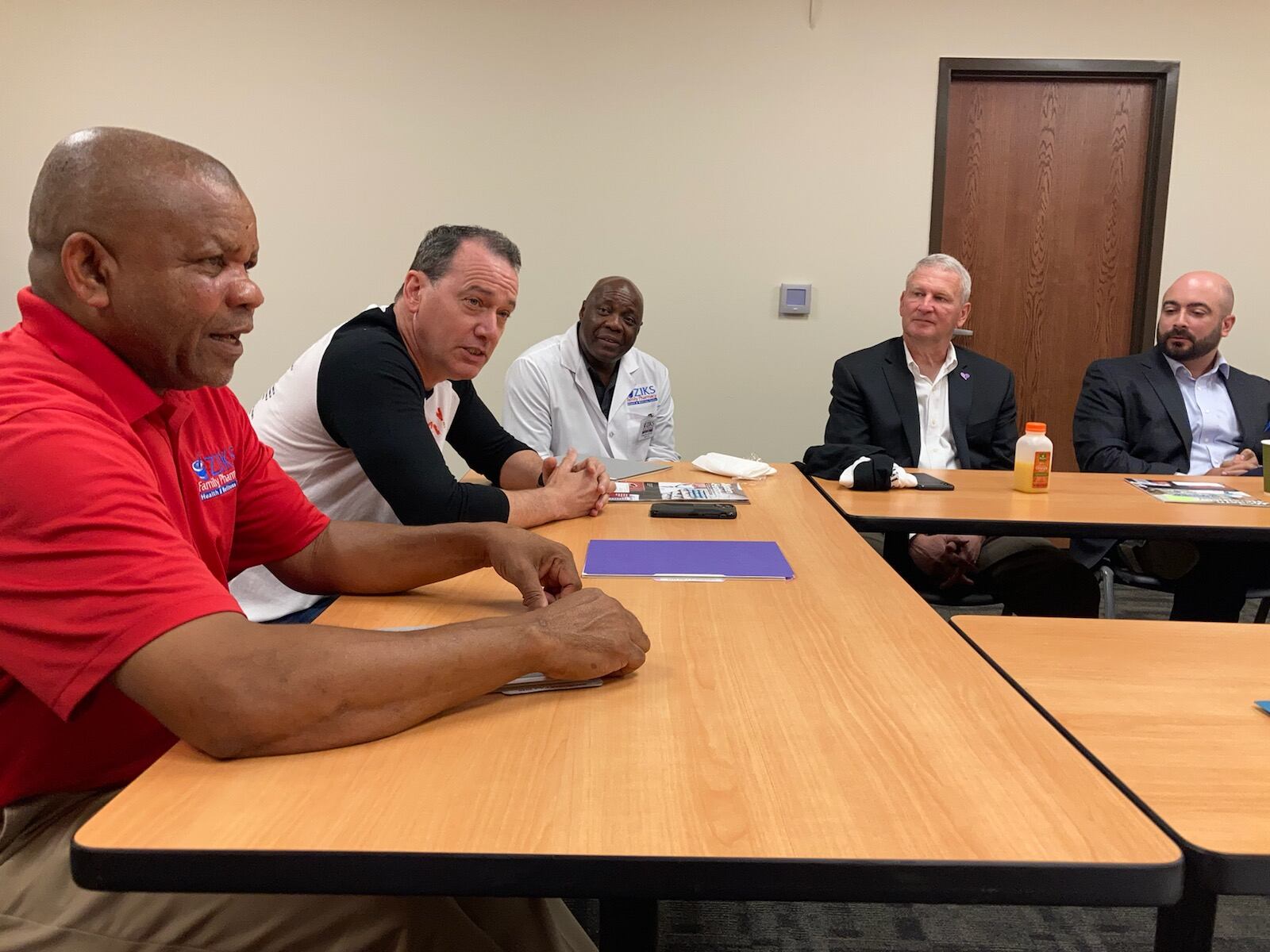 From left, Ziks Pharmacy owner Nnodum Iheme; Scott Knoer, CEO of the American Pharmacists Association; Ziks pharmacist Gregory Braylock; Stephen Ringel, CareSource Ohio market president; and Antonio Ciaccia, pharmacy consultant. KAITLIN SCHROEDER