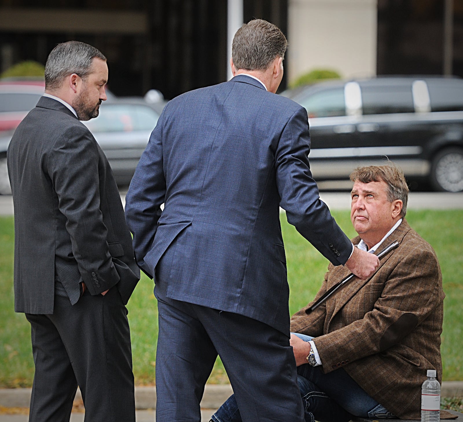 Steve Rauch, owner of Steve Rauch Inc., confers with attorneys in 2019. Marshall Gorby/Staff