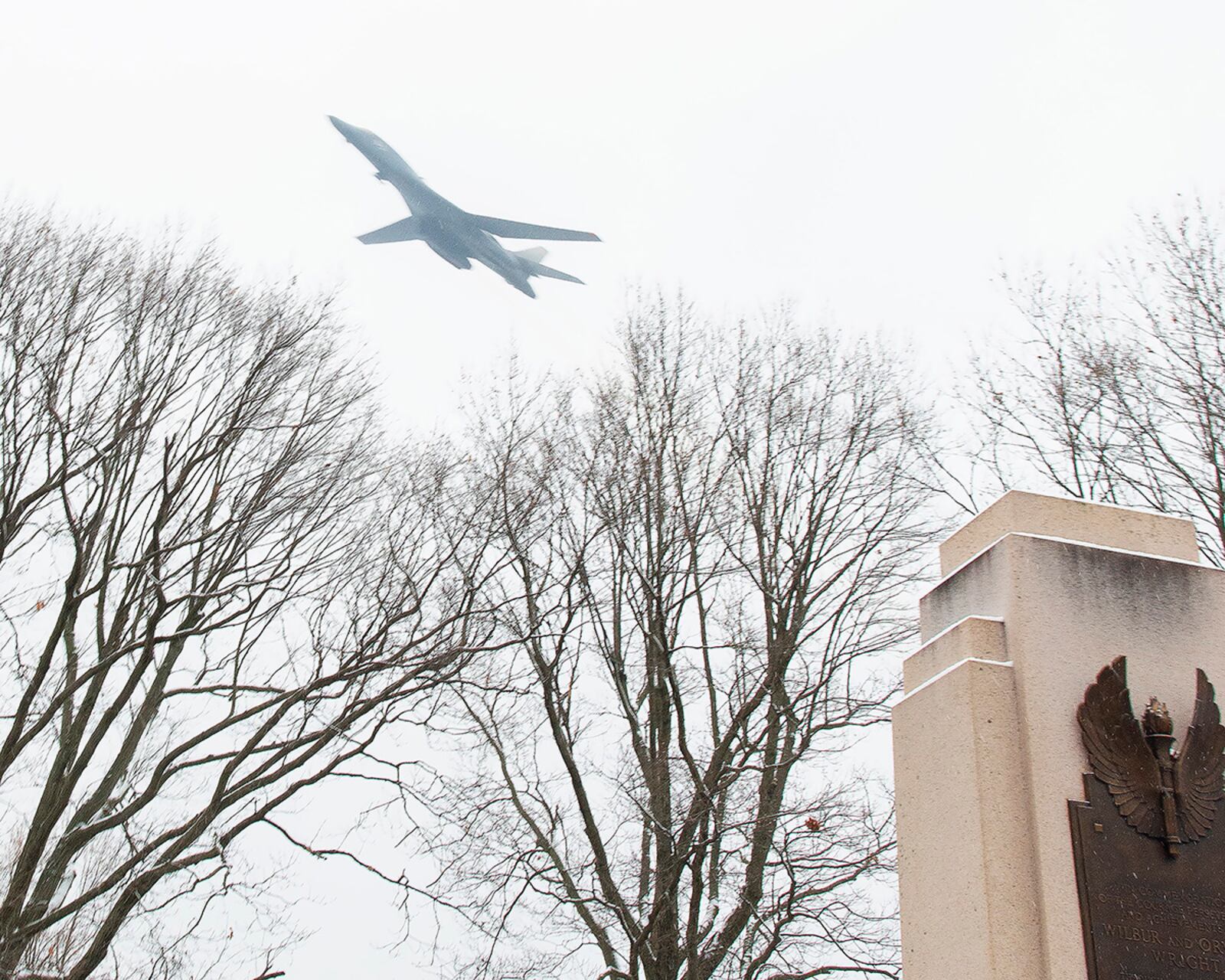 An Air Force B-1 Lancer Bomber flies over the Wright Brothers Memorial on Wright-Patterson Air Force Base during the Dec. 17 annual ceremony marking the 117th anniversary of the first powered flight. U.S. AIR FORCE PHOTO/R.J. ORIEZ