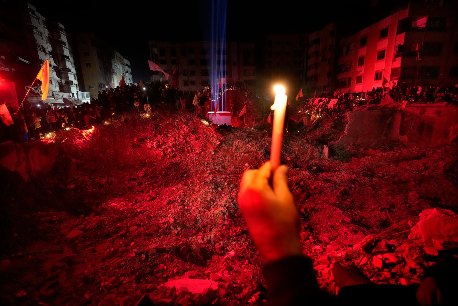 People gather at the site where former Hezbollah leader Sayyed Hassan Nasrallah was killed by Israeli airstrikes late September during a memorial ceremony in Dahiyeh, in the southern suburb of Beirut, Lebanon, Saturday, Nov. 30, 2024. (AP Photo/Hussein Malla)