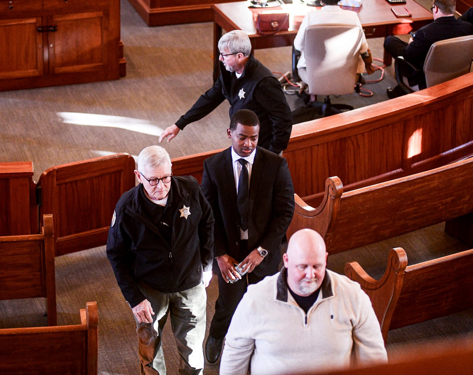 Sheldon "Timothy" Herrington Jr., who is on trial for the murder of University of Mississippi student Jimmie "Jay" Lee, leaves the courtroom as the jury is sent back for further deliberations, at the Lafayette County Courthouse in Oxford, Miss. on Wednesday, Dec. 11, 2024. (Bruce Newman/The Northeast Mississippi Daily Journal, via AP, Pool)