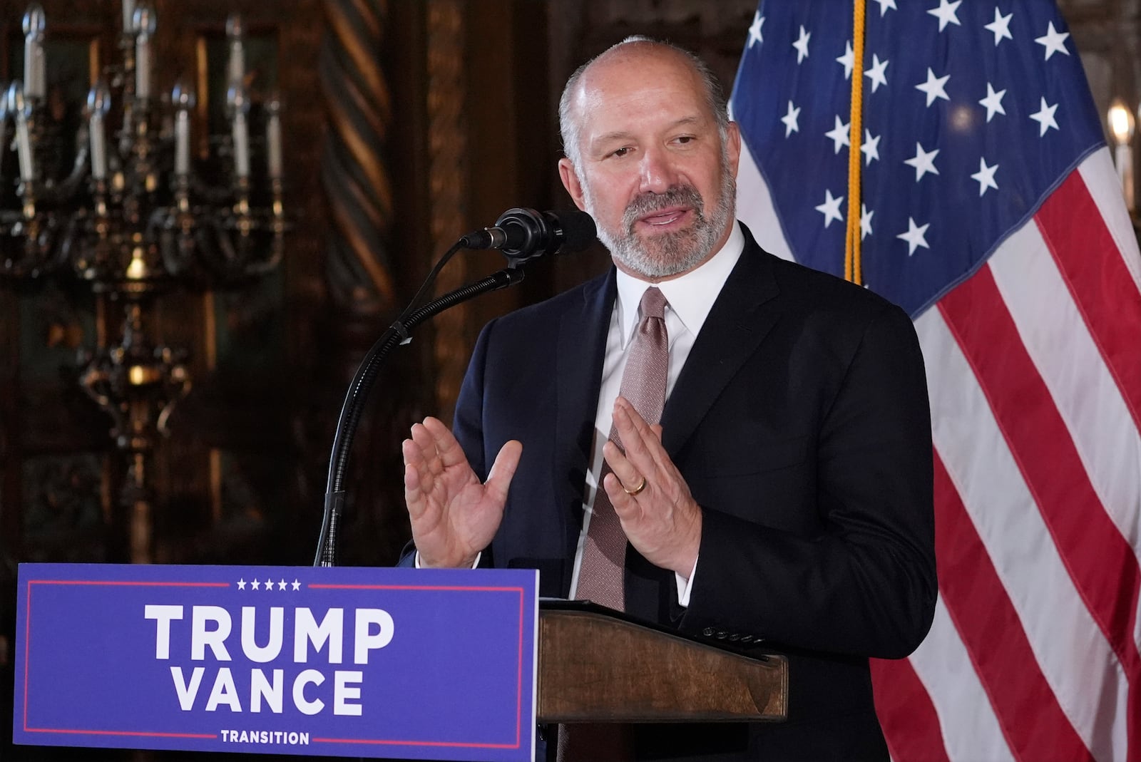 Commerce Secretary nominee Howard Lutnick speaks during a news conference with President-elect Donald Trump at Mar-a-Lago, Monday, Dec. 16, 2024, in Palm Beach, Fla. (AP Photo/Evan Vucci)