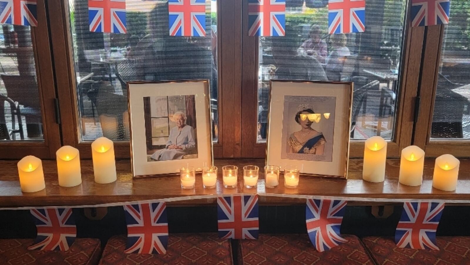 The Pub at The Greene in Beavercreek added a space for patrons to pay their respects to Queen Elizabeth II during England's 10 days of mourning last fall. CONTRIBUTED