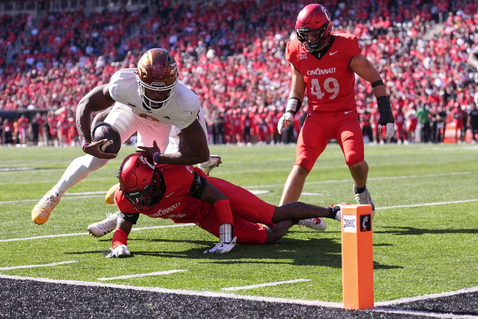 Arizona State's Jeff Sims runs short of a touchdown during the second half of an NCAA college football game against Cincinnati, Saturday, Oct. 19, 2024, in Cincinnati. (AP Photo/Kareem Elgazzar)