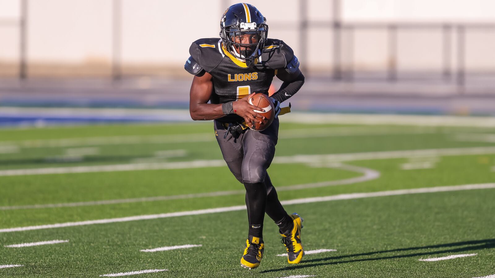 Meadowdale High School senior Te'Yann Martin rolls out to pass during their game against Alter on Thursday, Aug. 31 at Dayton Welcome Stadium. CONTRIBUTED PHOTO BY MICHAEL COOPER