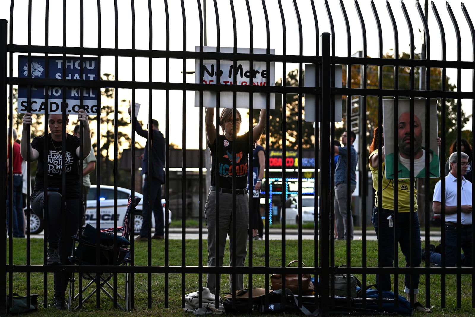 Protestors look on prior to the scheduled execution of Richard Moore outside of Broad River Correctional Institution, Friday, Nov. 1, 2024, in Columbia , S.C. (AP Photo/Matt Kelley)